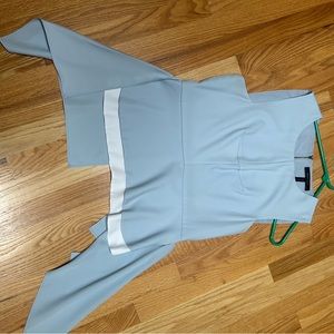 BCBGMaxarzia Fashion top with flowing side panels.